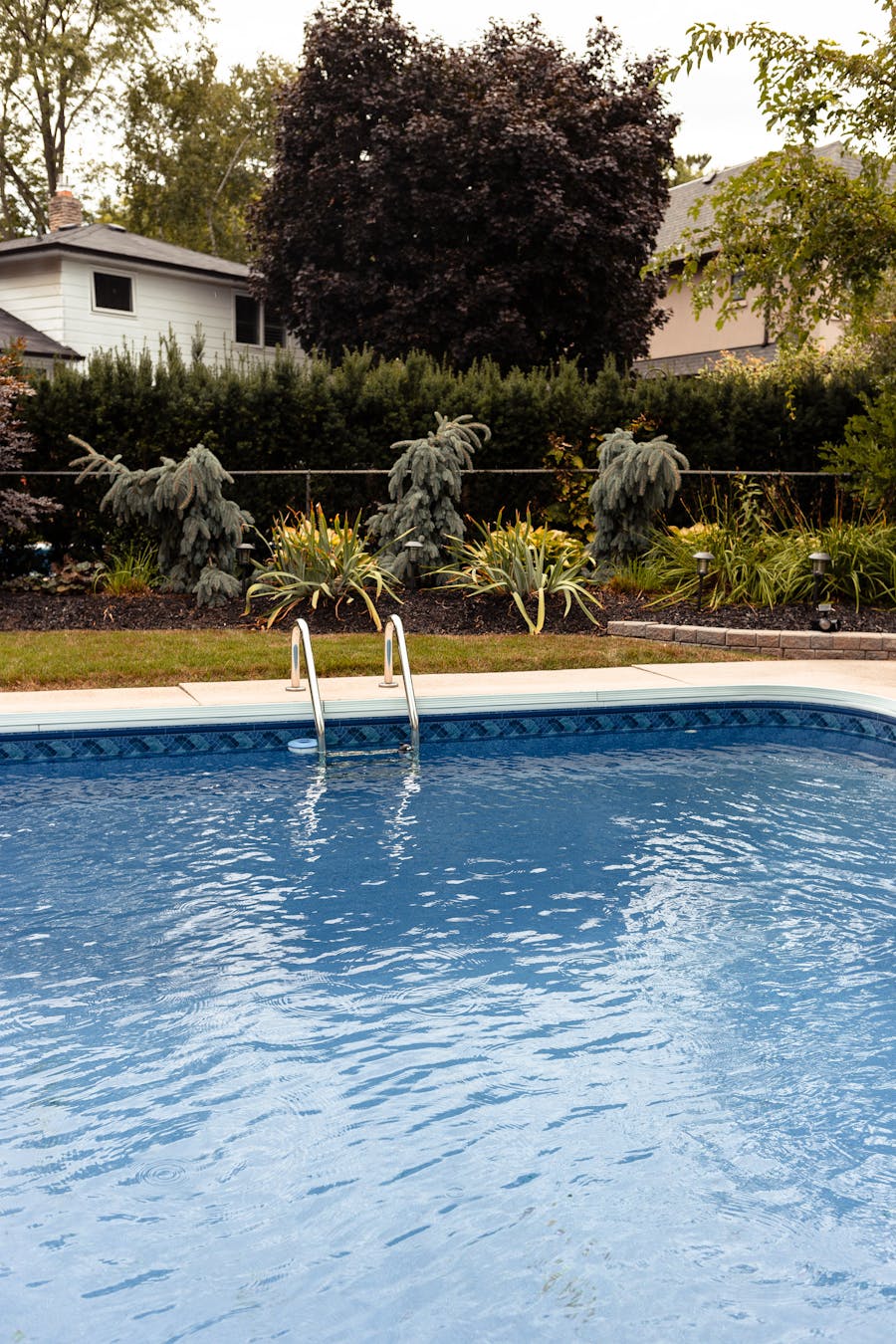 A residential backyard swimming pool in Trophy Club, Texas